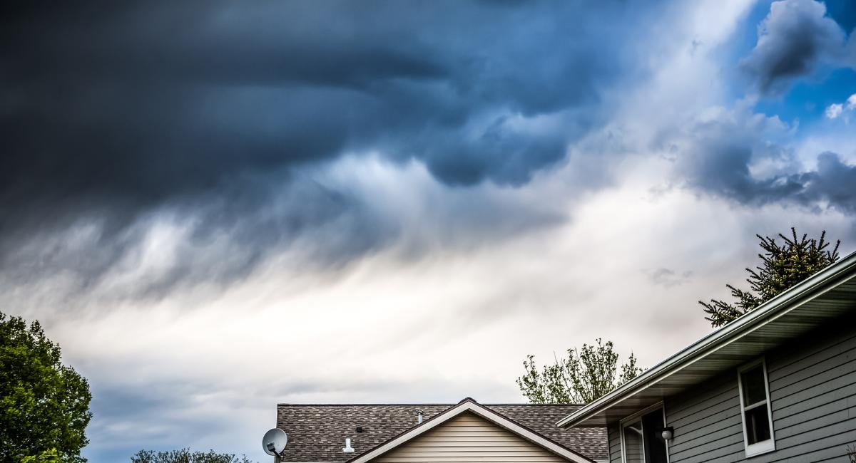 gloomy clouds over houses
