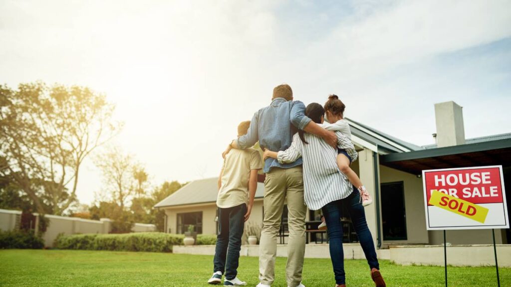 family on their recently bought house