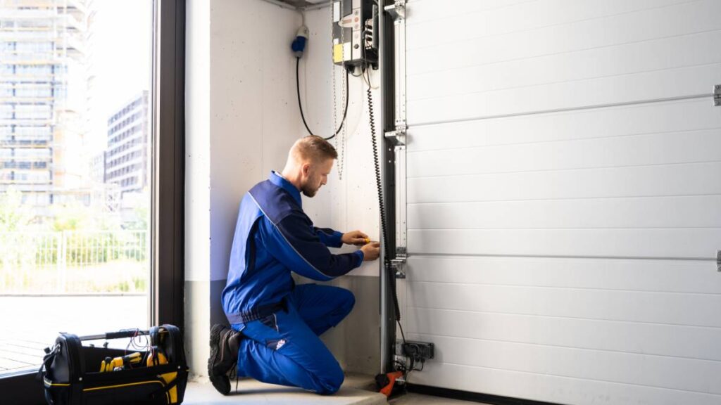 garage door repairman working