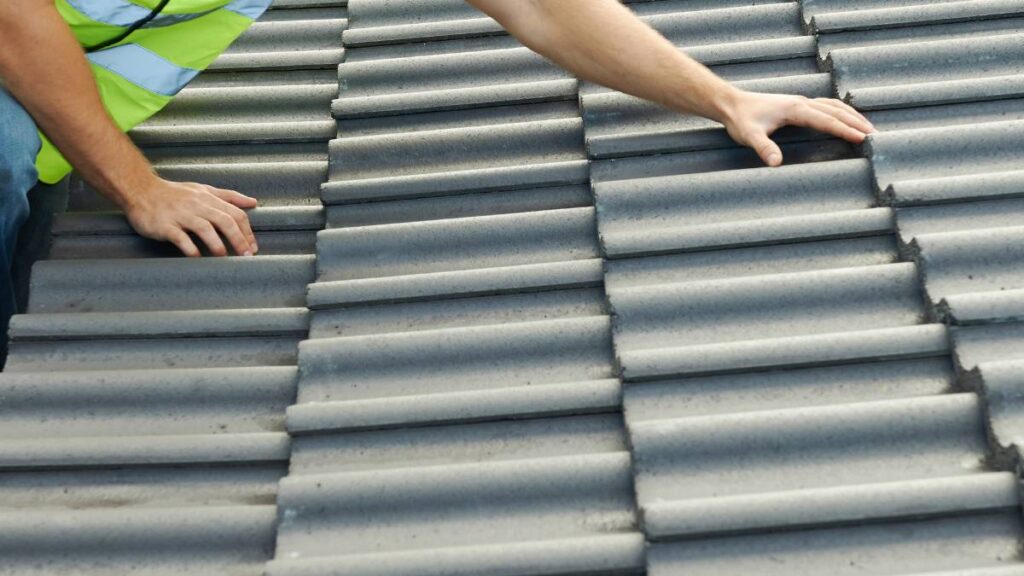 guy inspecting a roof