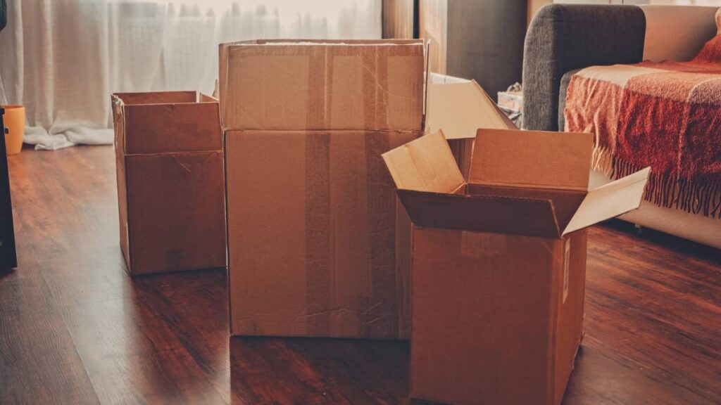 Empty boxes in the middle of living room