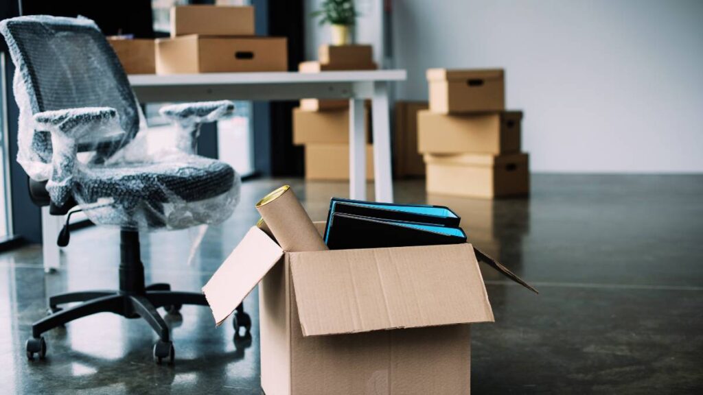 office chair with plastic and boxes with folders