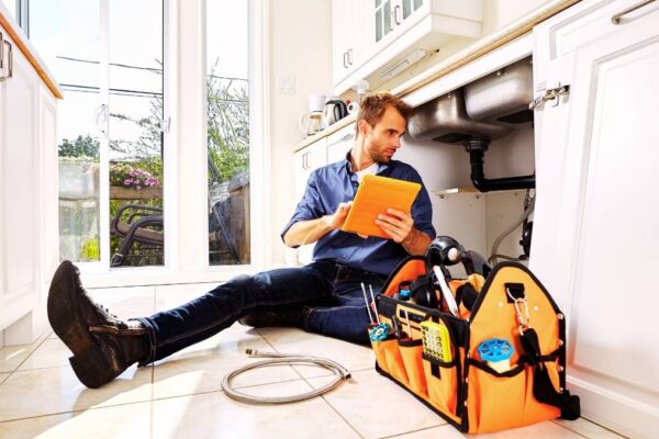 plumber doing a maintenance check