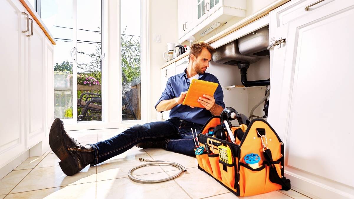 plumber doing a maintenance check